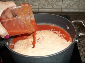 Add blended tomatoes to the stock pot